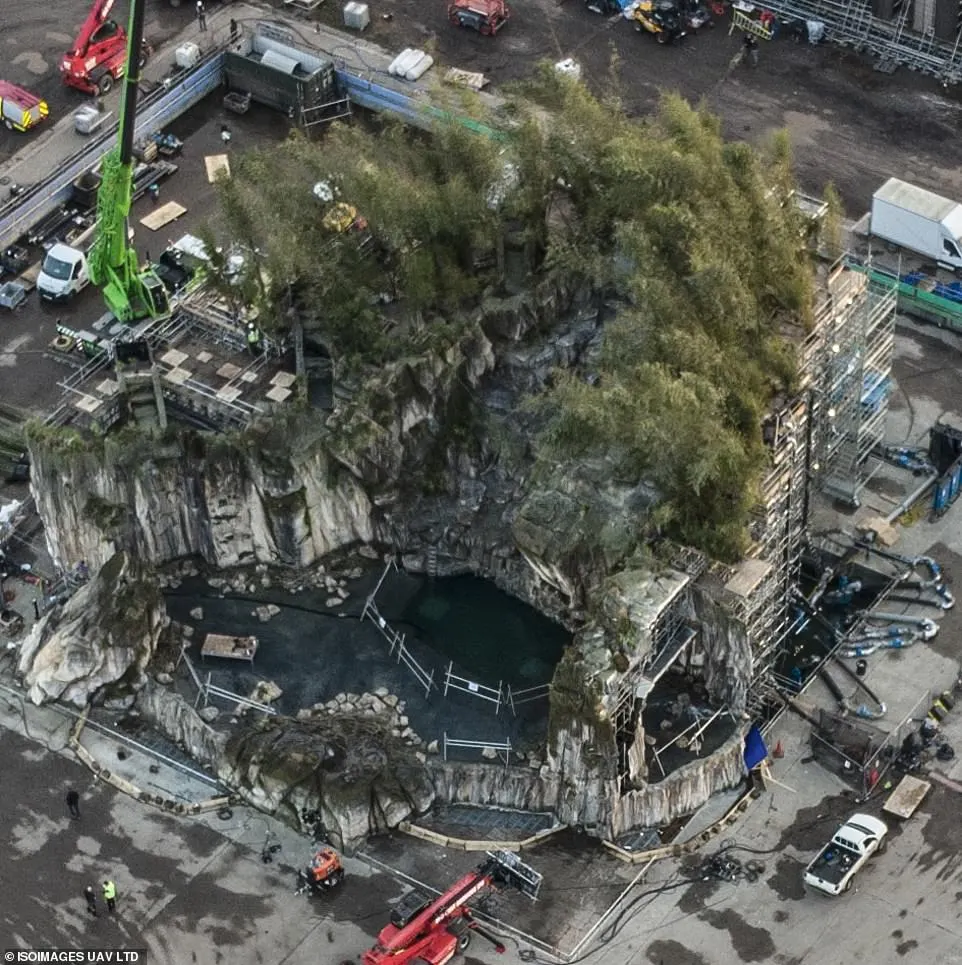 Impressive: Placed in a separate part of the film lot, the Batcave looked magnificent with its immense rock face which had been decorated with trees and shrubbery to exaggerate how vast the structure was